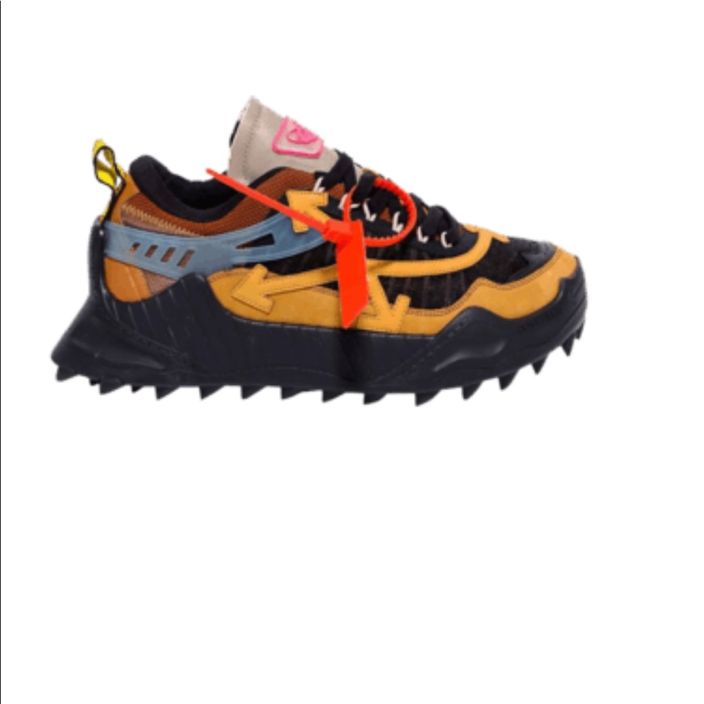 Slightly worn off white sneakers.